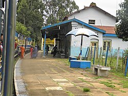 Mettupalayam-Ooty Mountain Train Hauled By Diesel Locomotive approaching Wellington Station