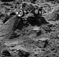 ojourner's left rear wheel is perched on the rock "Wedge" in this image, taken on Sol 47 by the Imager for Mars Pathfinder (IMP). The rover's Alpha Proton X-ray Spectrometer (APXS) is the cylindrical object extending from the back of the rover. This image and PIA01556(left eye) make up a stereo pair. Mars Pathfinder is the second in NASA's Discovery program of low-cost spacecraft with highly focused science goals. The Jet Propulsion Laboratory, Pasadena, CA, developed and manages the Mars Pathfinder mission for NASA's Office of Space Science, Washington, D.C. JPL is an operating division of the California Institute of Technology (Caltech).