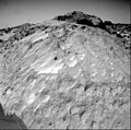 A close-up view of the rock "Moe" in the Rock Garden at the Pathfinder landing site. Moe is a meter-size boulder that, as seen from Sojourner, has a relatively smooth yet pitted texture upon close examination. Such a texture is seen on Earth on rocks that have been abraded by wind in a process that is analogous to sand blasting. This view of Moe shows two faces on the rock, one (left side of the rock) facing north-northeast and the other (right side) facing east. These two faces are thought to have been pitted and fluted by strong, "sand"- carrying winds from the northeast. Mars Pathfinder is the second in NASA's Discovery program of low-cost spacecraft with highly focused science goals. The Jet Propulsion Laboratory, Pasadena, CA, developed and manages the Mars Pathfinder mission for NASA's Office of Space Science, Washington, D.C. JPL is a division of the California Institute of Technology (Caltech).