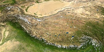 The Tibetan plateau lies between the Himalayan range to the south and the Taklamakan plain to the north.