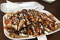 Halal snack pack, an Australian dish of doner kebab meat and chips with sauces.