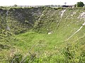 Le trou de mine, site préservé, permet d'imaginer l'importance des destructions lors de la bataille de la Somme.