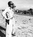 U.S. Americal Division commander, MajGen Alexander M. Patch, Jr., watches while his troops and supplies are staged on Guadalcanal's beaches on 8 December, the day before he relieved Gen Vandegrift.