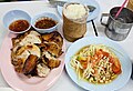 'Som tam' (papaya salad), 'Kai yang' (grilled chicken) and 'Khao niao' (sticky rice): a combination of dishes from Isan (Northeast Thailand) which has become extremely popular in the whole of Thailand - It is eaten as a snack or as a lunchtime meal