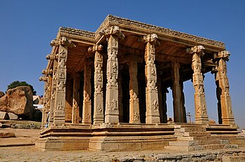 Tall Carved pillars of the Saasivekaalu Ganesha Temple at Hemakuta Hill