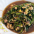 Phat phak khom: stir-fried Thai spinach (Amaranthus spinosus) with minced pork and egg.