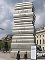 Image 7712-metre-high (40 ft) sculpture of a stack of books at the Berlin Walk of Ideas, commemorating the invention of modern book printing (from History of books)