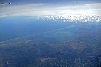 Aerial photo of Arabat Spit with the Syvash and Crimea in the foreground and the Black Sea in the background