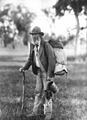 Image 3A swagman in bushman's apparel, wearing a brimmed hat and carrying swag and billy can (from Culture of Australia)