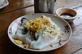 'Khao phan phak': steamed fermented rice batter wrapped around stir-fried vegetables