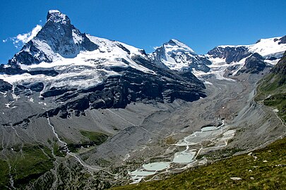 upper valley Mattertal (Zmutt valley) and montain Dent d'Hérens behind of the Matterhorn,