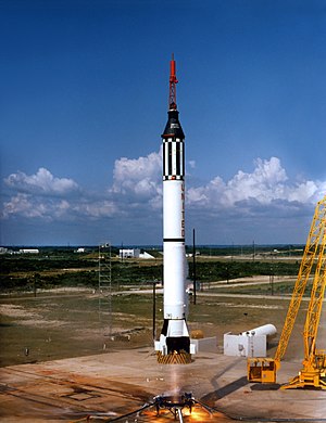 Freedom 7 lifts off. The engine's thrust has dissipated the mist. The exhaust plume is very pale because the engine burns ethyl alcohol fuel.