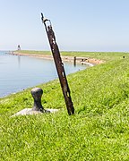 Stavoren Bollard + (artwork) on the harbor pier.