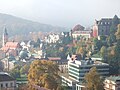 De Florentinerberg mei New Castle (top right), the Caracalla Spa (bottom right), and the Friedrichsbad (bottom left)