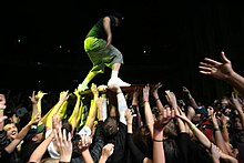 Bassist Kyle McDonald crowdsurfing