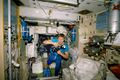 Cosmonaut Sergei K. Krikalev takes still pictures inside the Zvezda Service Module