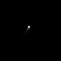 The solid nucleus of comet Borrelly is barely resolved in this image, enhanced to reveal the highly collimated dust extending towards the bottom left corner of the picture. The jet is attributed to dust carried outward by gas expanding outwards into a cone about 20 degrees across. The surface of Borrelly is composed of a mixture of dust and water ice, and as the comet approaches the Sun the water ice sublimes. The gases produced inside the comet by the Sun's heating race away from the surface into the vacuum of space, carrying the dust away with them. The jet was also seen in images acquired around 9 hours earlier. This suggests that the emission is coming from close to the rotation axis at the comet's constantly illuminated pole. The Sun is at the bottom of the image. Deep Space 1 completed its primary mission testing ion propulsion and 11 other advanced, high-risk technologies in September 1999. NASA extended the mission, taking advantage of the ion propulsion and other systems to undertake this chancy but exciting, and ultimately successful, encounter with the comet. More information can be found on the Deep Space 1 home page at http://nmp.jpl.nasa.gov/ds1/ . Deep Space 1 was launched in October 1998 as part of NASA's New Millennium Program, which is managed by JPL for NASA's Office of Space Science, Washington, D.C. The California Institute of Technology manages JPL for NASA.