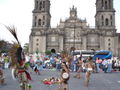 Aztec dancers on Zocalo with Cathedral in background