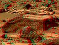 This view of the Chimp was produced by combining the "Super Panorama" frames from the IMP camera. Super resolution was applied to help to address questions about the texture of this rock and what it might tell us about its mode of origin. The composite color frames that make up this anaglyph were produced for both the right and left eye of the IMP. These composites consist of 7 frames in the right eye and 8 frames in the left eye, taken with different color filters that were enlarged by 500% and then co-added using Adobe Photoshop to produce, in effect, a super-resolution panchromatic frame that is sharper than an individual frame would be. These panchromatic frames were then colorized with the red, green, and blue filtered images from the same sequence. The color balance was adjusted to approximate the true color of Mars. The anaglyph view was produced by combining the left with the right eye color composite frames by assigning the left eye composite view to the red color plane and the right eye composite view to the green and blue color planes (cyan), to produce a stereo anaglyph mosaic. This mosaic can be viewed in 3-D on your computer monitor or in color print form by wearing red-blue 3-D glasses. Mars Pathfinder is the second in NASA's Discovery program of low-cost spacecraft with highly focused science goals. The Jet Propulsion Laboratory, Pasadena, CA, developed and manages the Mars Pathfinder mission for NASA's Office of Space Science, Washington, D.C. JPL is a division of the California Institute of Technology (Caltech). The left eye and right eye panoramas from which this anaglyph was created is available at PIA02405 andPIA02406