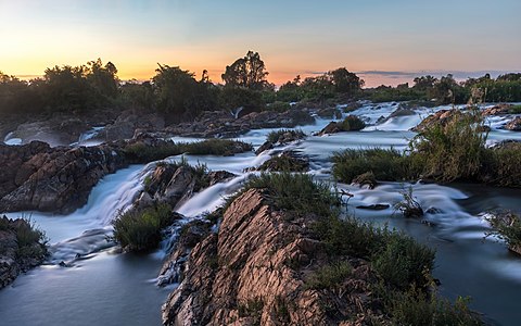 "Li_Phi_falls_at_dusk_with_colorful_sky_in_Don_Khon_Laos.jpg" by User:Basile Morin