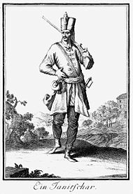 Black and white full-length drawing of a Janissary musketeer with a long moustache.