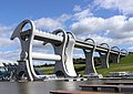 Image 4The Falkirk Wheel, named after the nearby town of Falkirk, is a rotating boat lift connecting the Forth and Clyde Canal with the Union Canal. The wheel raises boats by 24 metres. Photo credit: Sean Mack