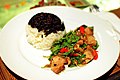 'Kraphao mu krop': Crispy belly pork stir fried with Thai basil ('bai kraphao'), here served with a mix of jasmine rice and unpolished (black coloured) jasmine rice which lends an additional nutty taste to the jasmine aroma