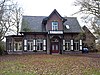 Villa met aangebouwd koetshuis (tot 1984: Meta)