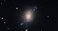 ESO 486-21 is a spiral galaxy with a somewhat irregular and ill-defined structure.[၆]