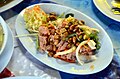 'Yam naem' is a Thai salad made from fermented raw pork sausage ('naem')