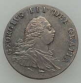 Silver coin showing bust of a man