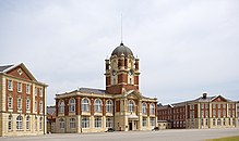 Red-brick buildings with large windows