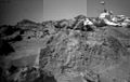 This image was taken by the Sojourner rover's right front camera on Sol 33. The rock in the foreground, nicknamed "Ender", is pitted and marked by a subtle horizontal texture. The bright material on the top of the rock is probably wind-deposited dust. The Pathfinder Lander is seen in the distance at right. The lander camera is the cylindrical object on top of the deployed mast. Mars Pathfinder is the second in NASA's Discovery program of low-cost spacecraft with highly focused science goals. The Jet Propulsion Laboratory, Pasadena, CA, developed and managed the Mars Pathfinder mission for NASA's Office of Space Science, Washington, D.C. JPL is a division of the California Institute of Technology (Caltech).