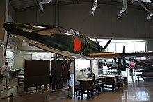 A photo of the Kyushu J7W Shinden replica inside a museum