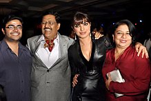 Priyanka Chopra and her family are looking towards the camera.