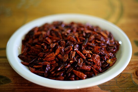 White plate full of dried peperoncino