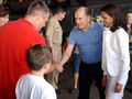 Robert Duvall and Actress Luciana Pedraza shake hands with a member of the "The Black Stallions" of Helicopter Combat Support Squadron Four (HC-4), Naval Air Station Sigonella, Sicily, June 14, 2003