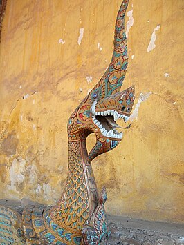 Een naga als bewaker van de tempel Wat Si Saket in Vientiane, Laos