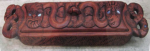 Maori wood carving pencil box representing Rangi and Papa with inset Pāua shell eyes, (NZ)