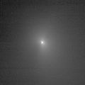 This image shows comet Tempel 1 as seen through the clear filter of the medium resolution imager camera on Deep Impact. It was taken on June 26, 2005, when the spacecraft was 7,118,499.4 kilometers (4,423,435 miles) away from the comet. Eight images were combined to create this picture, and a logarithmic stretch was applied to enhance the coma of the comet.