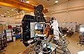 This image shows NASA's Deep Impact spacecraft being built at Ball Aerospace & Technologies Corporation, Boulder, Colo. On July 2, at 10:52 p.m. Pacific time (1:52 a.m. Eastern time, July 3), the spacecraft's impactor will be released from Deep Impact's flyby spacecraft. One day later, it will collide with Tempel 1. The impactor cannot directly talk to Earth, so it will communicate via the flyby spacecraft during its final day. The two spacecraft communicate at "S-band" frequency. The flyby's S-band antenna is the gold, rectangle-shaped object seen on the spacecraft, in the middle of this picture.