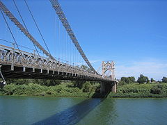 The suspension bridge over the Ebro river in Amposta (Montsià), by J. Eugenio Ribera, 1921.