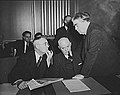 Image 48John L. Lewis (right, President of the United Mine Workers, confers with Thomas Kennedy (left), UMW Secretary-Treasurer of the UMW, and a UMW official at the War Labor Board in 1943 about a coal miners' strike.