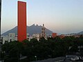 Faro del Comercio (left) and the Metropolitan Cathedral of Our Lady of Monterrey (right).