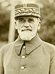 A headshot of Gustave Ferrié, with a military cap, from 1932