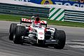 Takuma Sato celebrating his podium at the 2004 United States GP