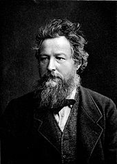 Photo portrait en noir et blance de William Morris, il porte une barbe