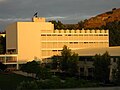 Eastern face of Building 9 with the 'CPP' hill visible in the distance