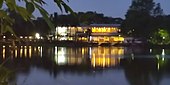 Reflections of the rowing clubs around the lake at night