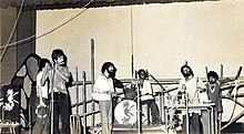 Moheener Ghoraguli in concert at Rabindra Sadan, 1979, left to right: Raja Banerjee, Pradip Chatterjee, Tapas Das, Pranab Sengupta, Gautam Chattopadhyay and Ranjon Ghoshal. Not shown also present were Abraham Mazumder and Biswanath Chattopadhyay